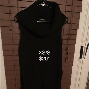 Black sleeveless turtle neck sweater